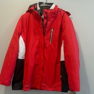 This is raspberry color Free Country Red Ski Jacket with Black and White Accents